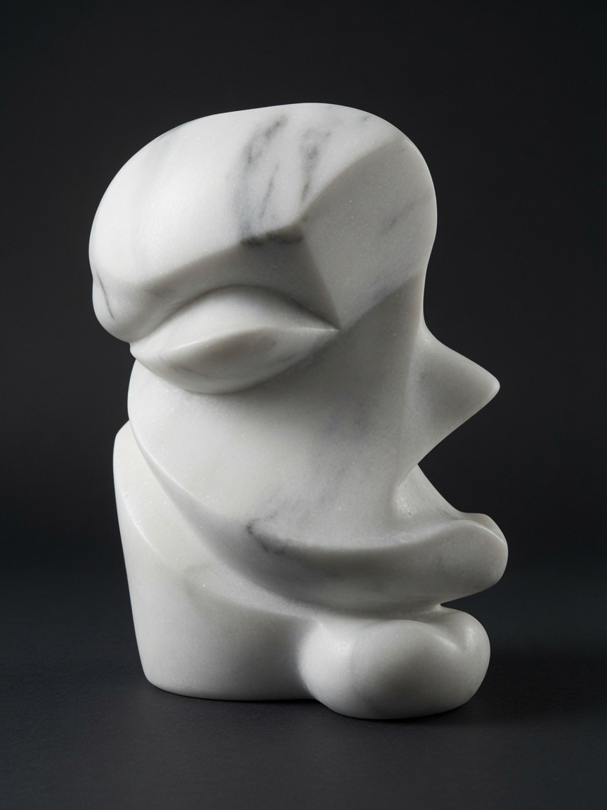 Repose — carved abstract marble face sculpture